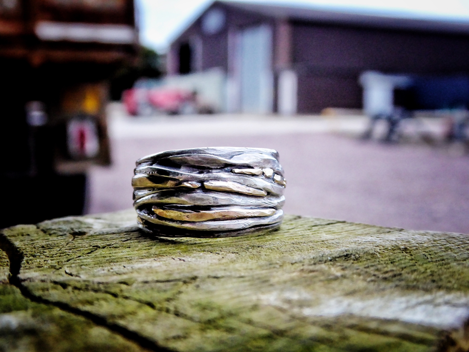 By Carol Clift - Hand beaten silver ring with 18ct yellow gold detail.