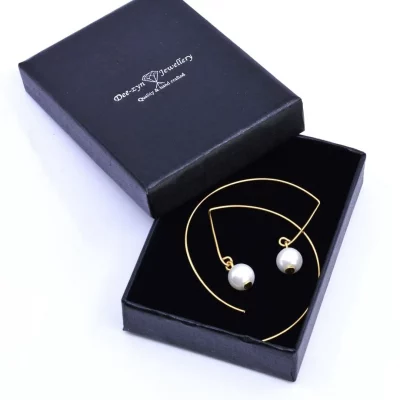 Gold modern pearl bead earrings in box