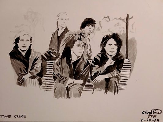 Picture of 5 people. 3 sat on a bench with 2 behind them