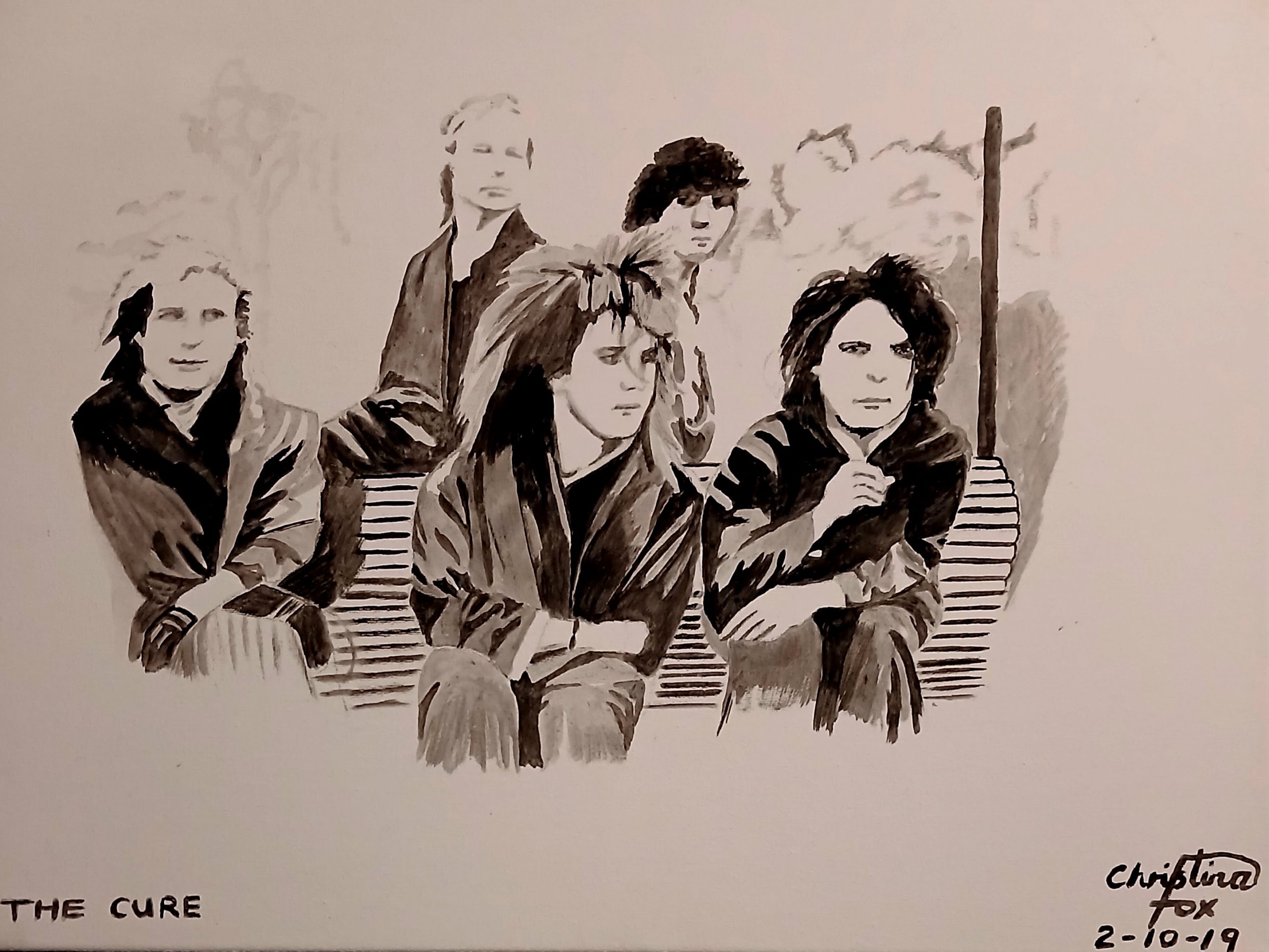 Picture of 5 people. 3 sat on a bench with 2 behind them