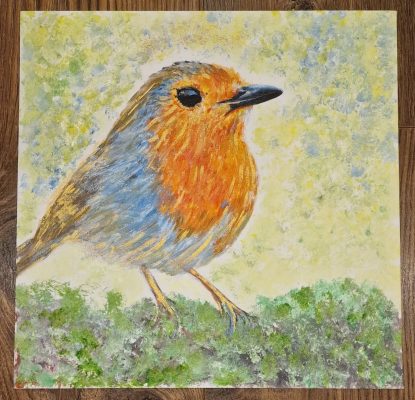 Painting of Robin sat on greenery.