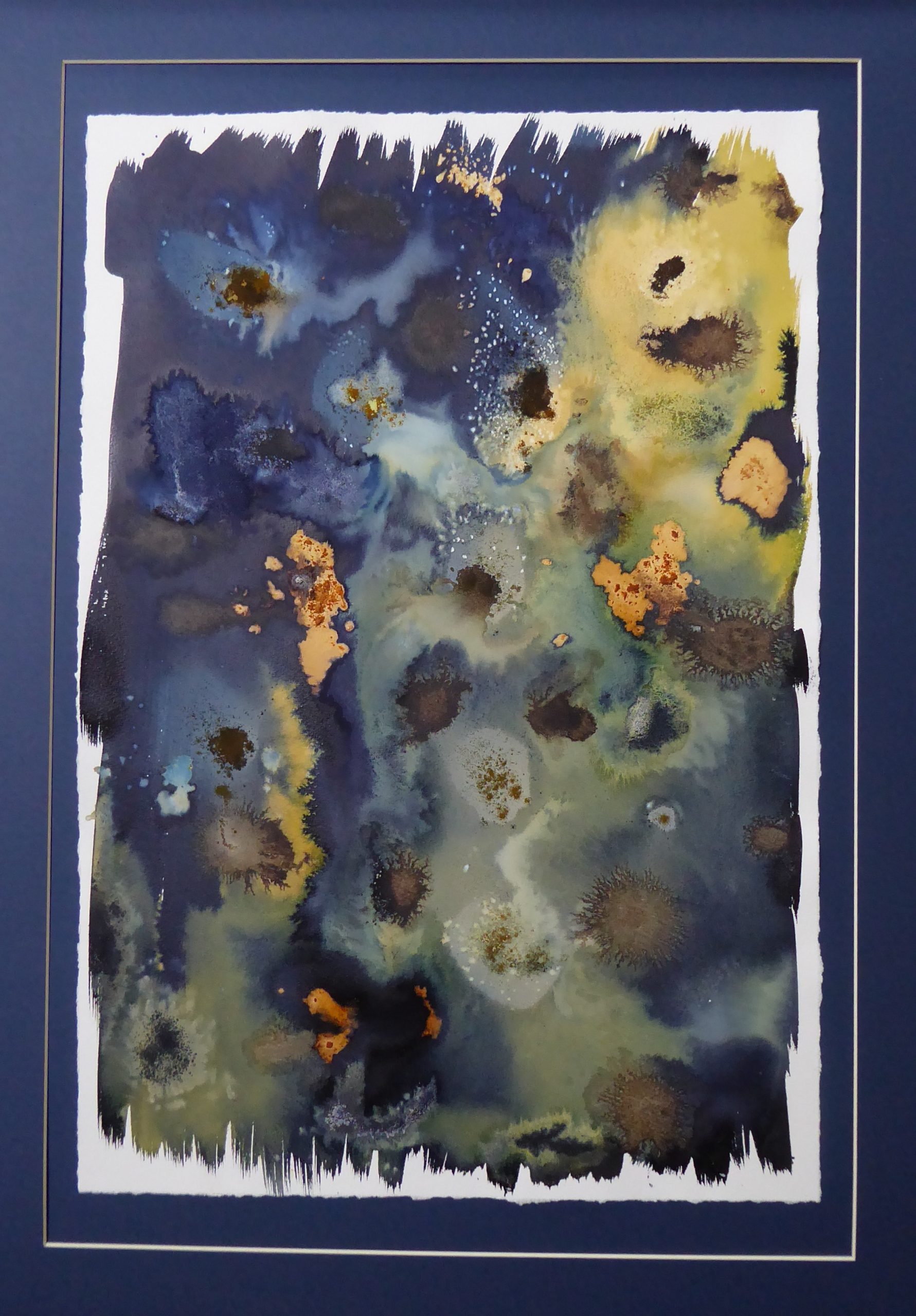 An abstract cyanotype with blue, copper and green tones. The colours bleed together to make an image that could have been taken from space of the Great Salt Desert.
